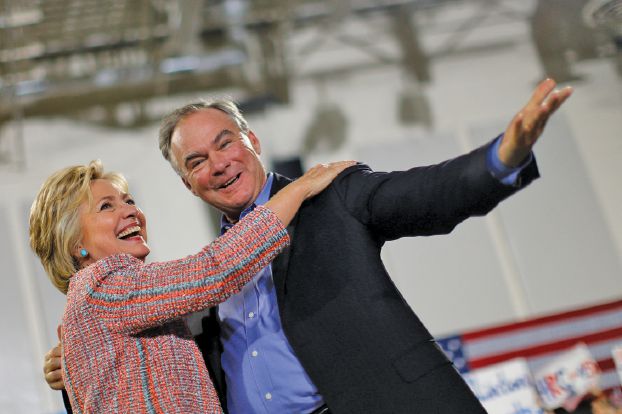 FILE PHOTO: Democratic U.S. presidential candidate Hillary Clinton and U.S. Senator Tim Kaine (D-VA) react during a campaign rally at Ernst Community Cultural Center in Annandale, Virginia, U.S., July 14, 2016.  REUTERS/Carlos Barria/File photo     TPX IMAGES OF THE DAY