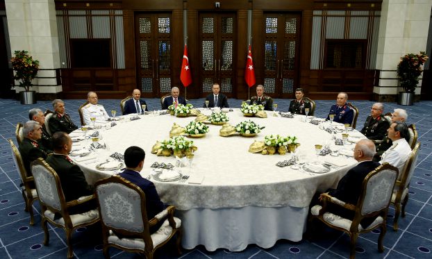 Turkey's President Tayyip Erdogan (C) meets with Turkey's Prime Minister Binali Yildirim (8th L), Chief of Staff General Hulusi Akar (7th R) and the members of High Military Council around a dinner table at the Presidential Palace in Ankara, Turkey, July 28, 2016. Kayhan Ozer/Presidential Palace/Handout via REUTERS ATTENTION EDITORS - THIS PICTURE WAS PROVIDED BY A THIRD PARTY. FOR EDITORIAL USE ONLY. NO RESALES. NO ARCHIVE.   TPX IMAGES OF THE DAY