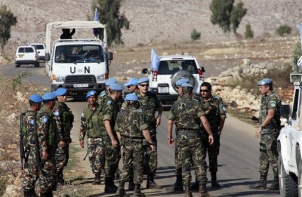 U.N. peacekeepers arrive at the area from which Tuesday's rocket was launched into Israel, in the southern border village of Houla, Lebanon, Wednesday, Oct. 28, 2009. Lebanese troops found and dismantled four rockets near the border with Israel on Wednesday, a day after a brief flare-up across the tense boundary, a Lebanese military official said. (AP Photo/Mohammed Zaatari)