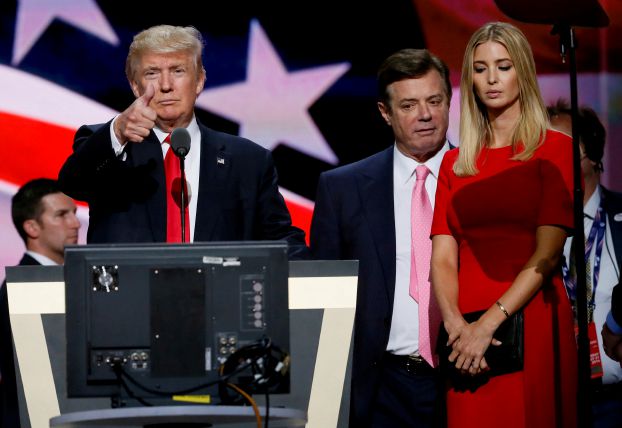 Republican presidential nominee Donald Trump gives a thumbs up as his campaign manager Paul Manafort (C) and daughter Ivanka (R) look on during Trump's walk through at the Republican National Convention in Cleveland, U.S., July 21, 2016. REUTERS/Rick Wilking/File Photo