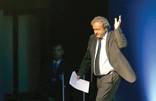 Former UEFA President Michel Platini, waves after his speech during the vote for the new UEFA president a in Athens, on Wednesday, Sept. 14, 2016. European soccer federations will elect  Wednesday a new UEFA president to replace Michel Platini, who is serving a four-year ban from the sport. (AP Photo/Thanassis Stavrakis)